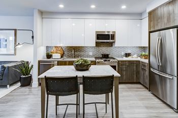 Stainless-steel appliances including premium slide-in gas ranges